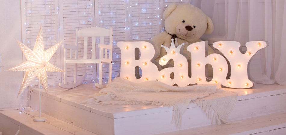 light, beautiful nursery with a teddy bear