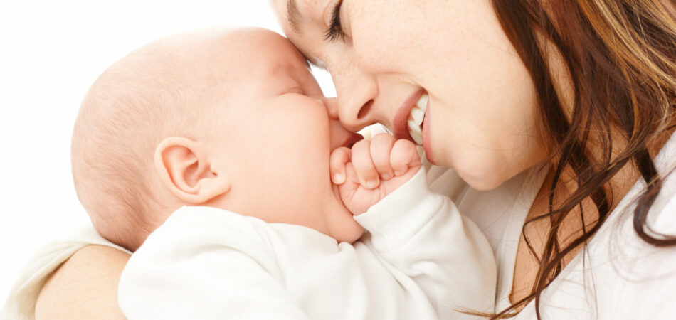 Mother smile to her child, isolated over white